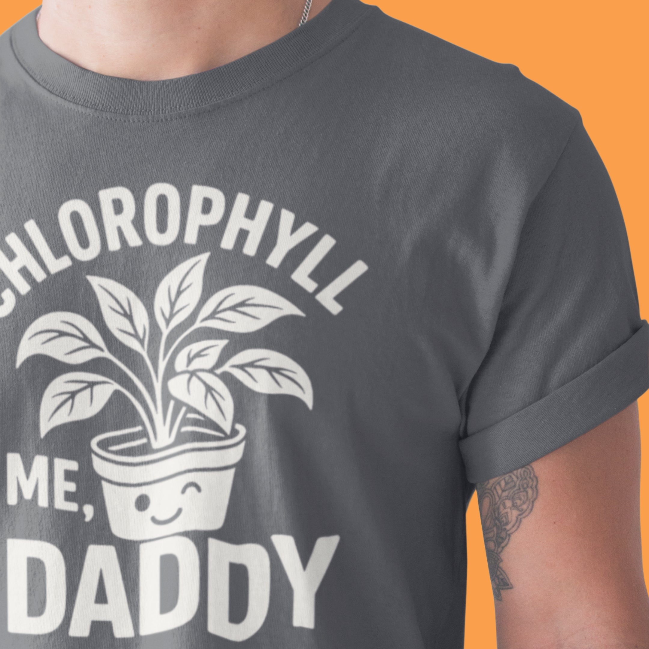 Gray t-shirt with a plant graphic and text on an orange background