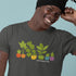 Person wearing a t-shirt with plant design and text, smiling against a light blue background